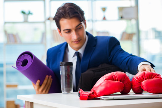 Man with boxing gloves in the office
