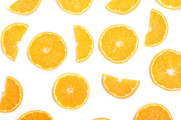 Slices of orange or tangerine isolated on white background. Flat lay, top view. Fruit composition