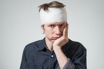 Man with bandage on his head