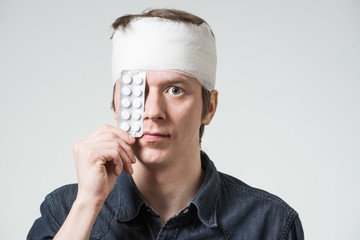 Man with bandage on his head