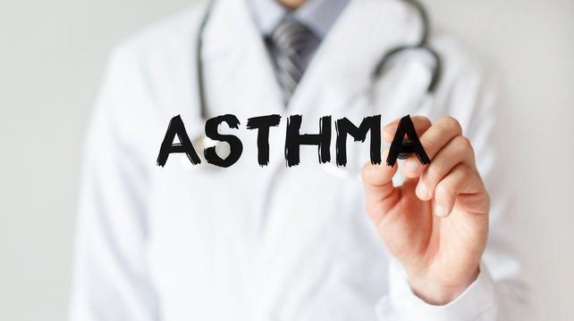 Doctor writing word Asthma with marker, Medical concept