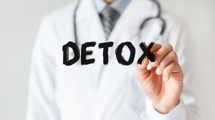 Doctor writing word Detox with marker, Medical concept