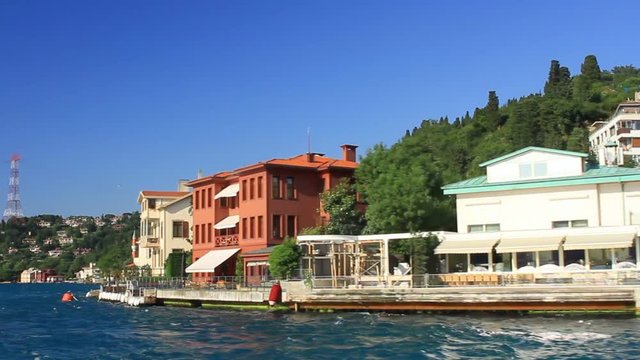 Luxury residences along Bosphorus Sea Coastline. Bosporus cruise tour sailing at Vanikoy, Istanbul, Turkey.