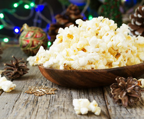 popcorn on the background of Christmas and New Year's decorations, selective focus