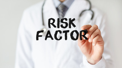 Doctor writing word Risk Factor with marker, Medical concept