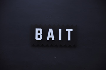 Bait logo on the dark wall