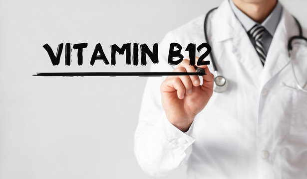 Doctor writing word Vitamin B12 with marker, Medical concept