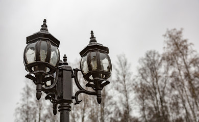 Fototapeta na wymiar Vintage black lantern on a city street 