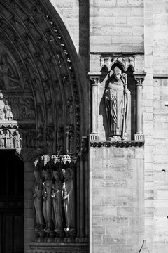 Fototapeta Notre Dame de Paris Cathedral: Architectural details in black and white. Paris, France