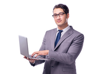 Young businessman working on laptop isolated white