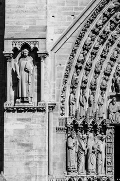 Fototapeta Notre Dame de Paris Cathedral: Architectural details in black and white. Paris, France
