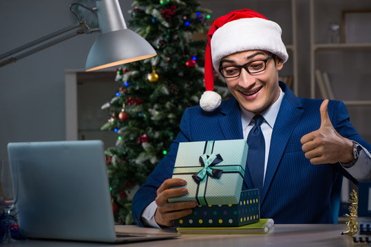 Businessman working late on christmas day in office