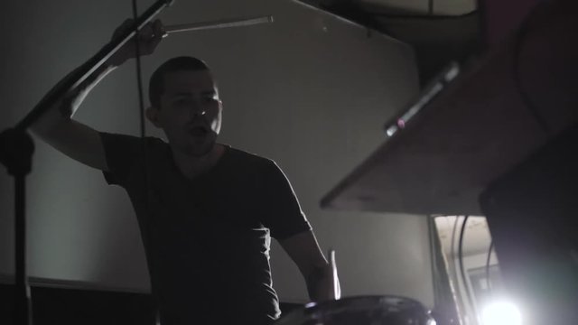 Club dj team scratching vinyl records on stage. hip hop djs playing music tracks on concert in the night club with drum sticks on pad. Dj scratch vinyl record. Beat maker play music on beat machine