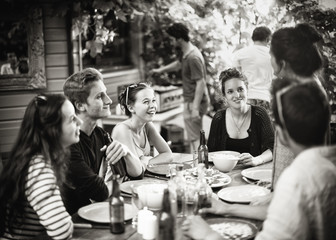 Students having fun while they prepare a bbq and drinking beers