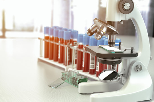 Microscope medical test tubes with blood samples in laboratory,