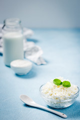Fresh homemade dairy productson blue background. Selective focus, copy space. 