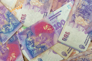 close up to level view of hundred argentinians pesos bills