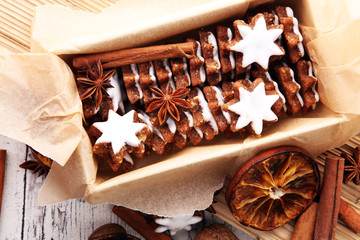freshly baked gingerbread star cookies in a box.