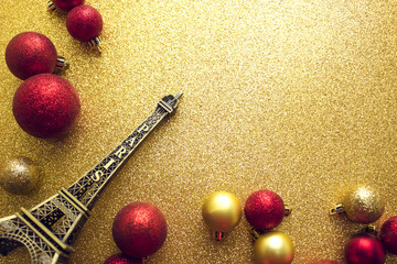 red gloss ball glitter with ball decor  on gold background with paris france eiffel tower in chrismas concept
