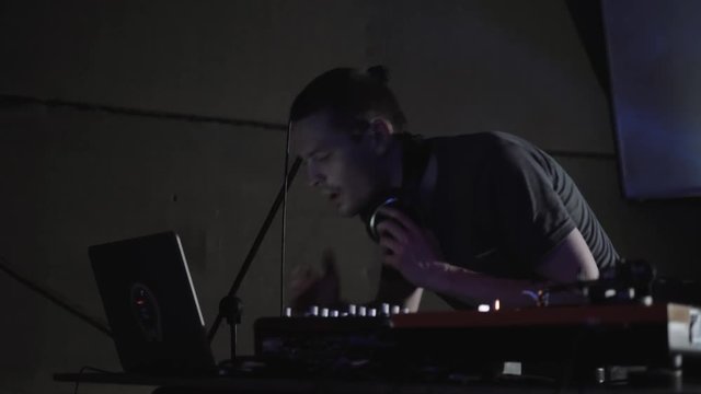 Hip hop music party in night club bar.Rap mc sing in microphone, DJ scratch records with music tracks, drum stick pad rock show repetition, fest event