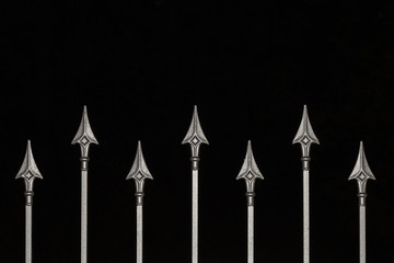 Decorative metal fence on a black background