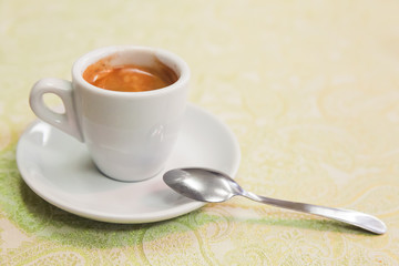Freshly brewed espresso coffee in white cup