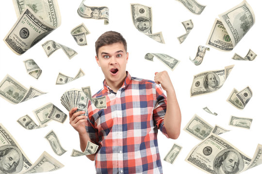 Young man with money on white background