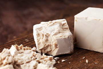 Dry yeast crumbled and yeast block for baking.