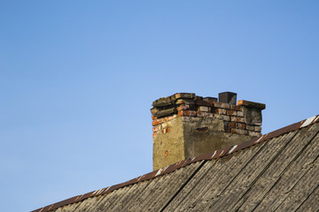 old chimney from the brick of a dilapidated house