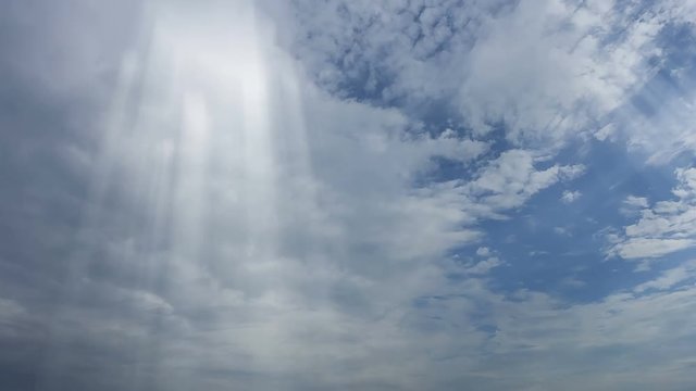 Dramatic sun rays and clouds as background