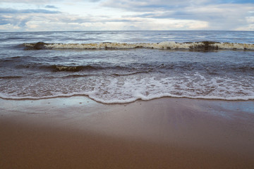 Landscape of sea to the horizon. The natural elements water Ocean waves. Wild sea storm - hazardous weather. The waves lapping on the shore. 