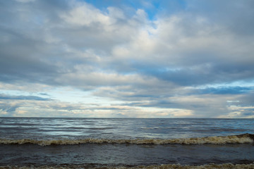 Landscape of the sea to the horizon. The natural elements water Ocean waves. Wild sea storm - hazardous weather. The waves lapping on the shore.