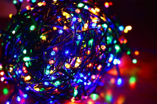 Closeup of a tangled multi color led string.