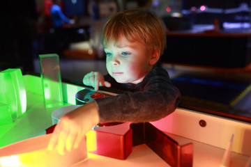 Preschooler studying the refraction of light