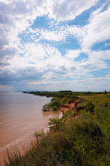 The shore of the Volga in the summer. Beautiful view, the high bank of the Volga River in Russia in the summer.