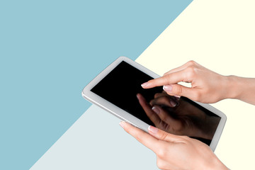 hands holding a tablet