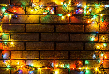 Wreath and garlands of colored light bulbs.Christmas background 