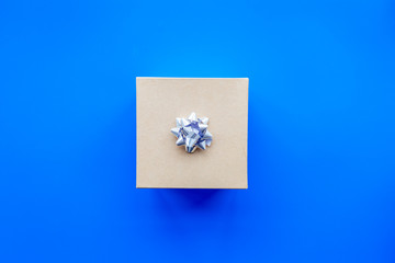 Shopping and sales. Gift box on blue background top view copyspace
