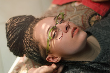 Young woman portrait lying on bed