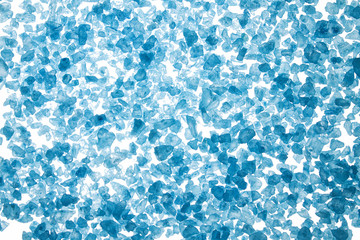 Blue sea salt crystals on white background