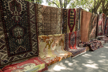 Sale of carpets at a bazaar in Yerewan