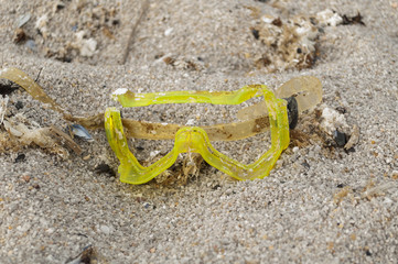 Fototapeta na wymiar Diving mask broken in the sand