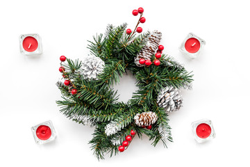 Christmas decorations. Wreath and toys on white background top view