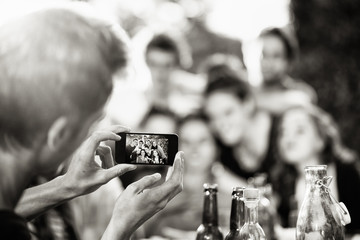 A group of students pose while a friend takes a picture