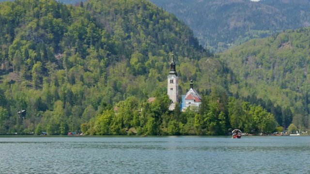 Bled Church Hyperlapse 4K Ultra High Definition. Bled lake its castle and iconic island with church is a Slovenia Alps turistic place with terme, hotel and beutiful landscapes. Bled 1 May 2017.