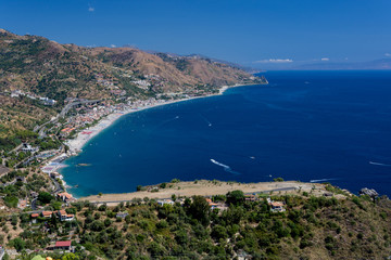 Fototapeta na wymiar panorama of the coast of Ionian sea from greek theater in Taormina in a summer day,sicily ,Italy
