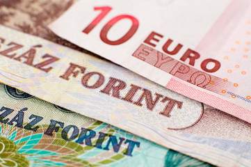 10 Euro banknote sits on top of two Hungarian Forint Banknotes