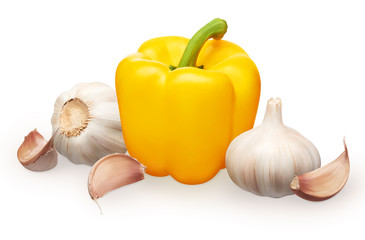 Whole fresh yellow bell pepper and garlic with cloves
