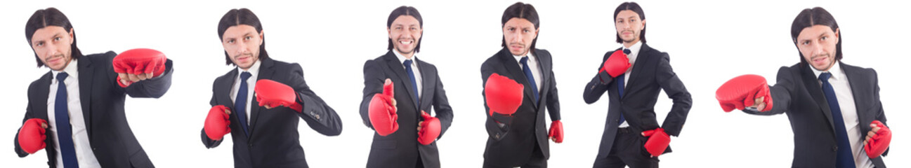 Businessman with boxing gloves on white