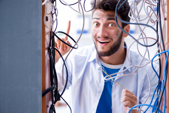 Electrician trying to untangle wires in repair concept